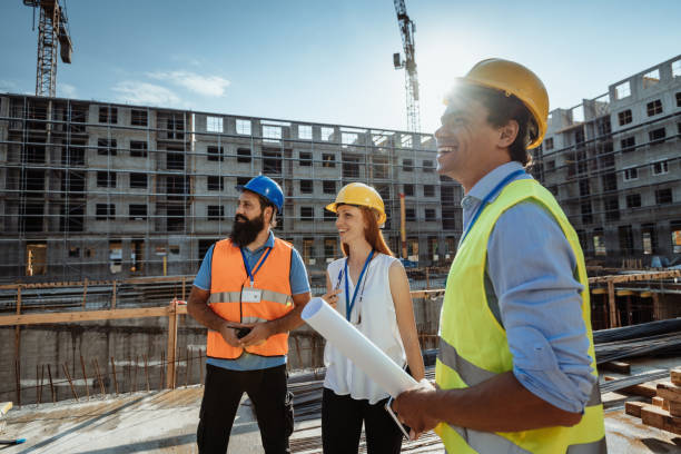 istock Latin American investor with colleagues on construction site 1327259924