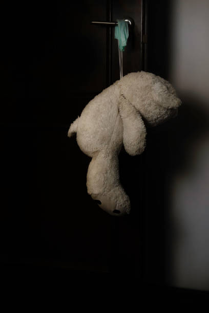 istock A white teddy bear hangs on the door handle. 1327261057