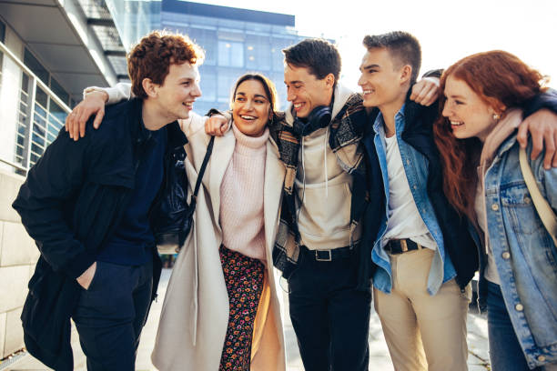 istock Young students walking together in high school 1327261740