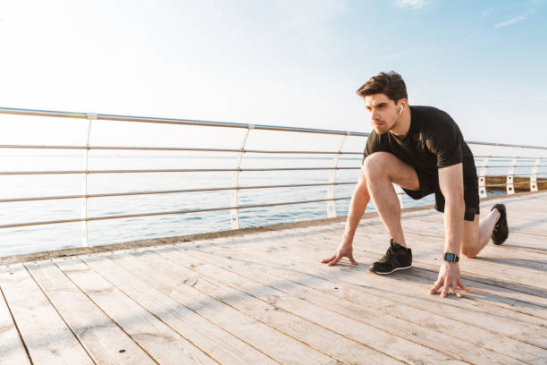 istock Concentrated sportsman outdoors on the beach 1327263046