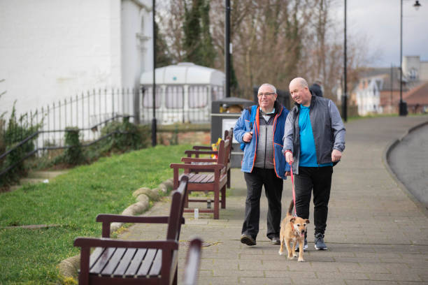 istock Walking The Dog Along The Coast 1327265835
