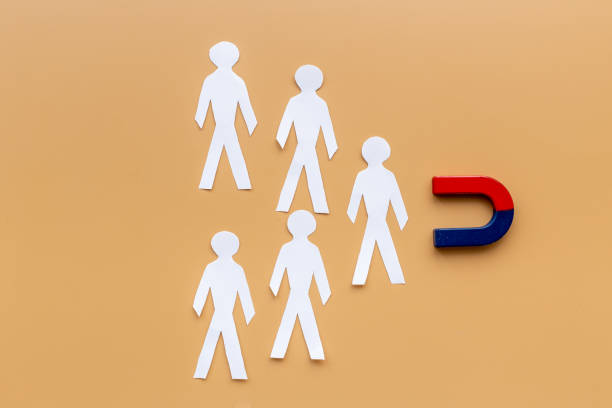 istock Horseshoe magnet attractives human figures. Increase team and recruiting concept 1327266132