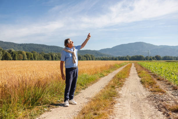 istock Caucasian Senior Man Flying A Kite 1327267780