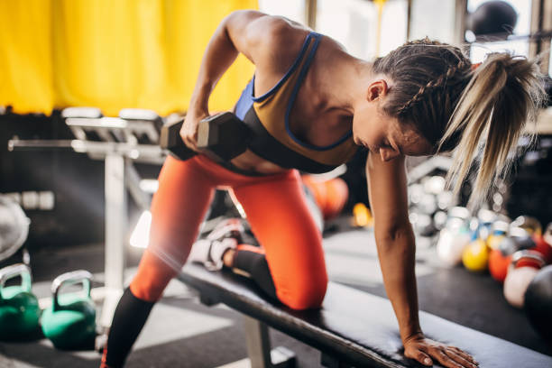 istock Woman training with dumbbell 1327270816