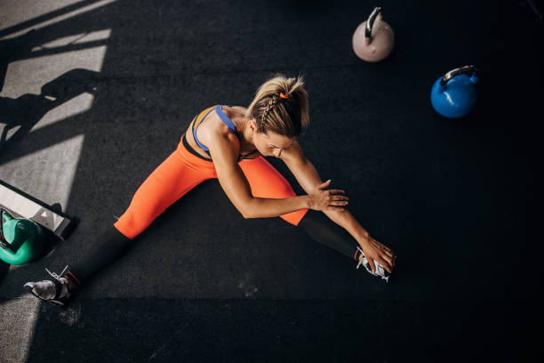 istock Woman warming up in gym 1327271475
