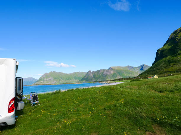 istock Camper car on beach, Lofoten islands, Norway 1327273053