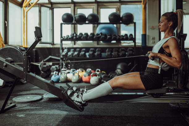 istock Fit woman training on rowing machine 1327273269