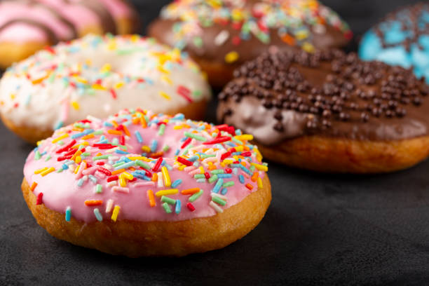 istock Delicious assorted colorful donuts on the table. 1327273420