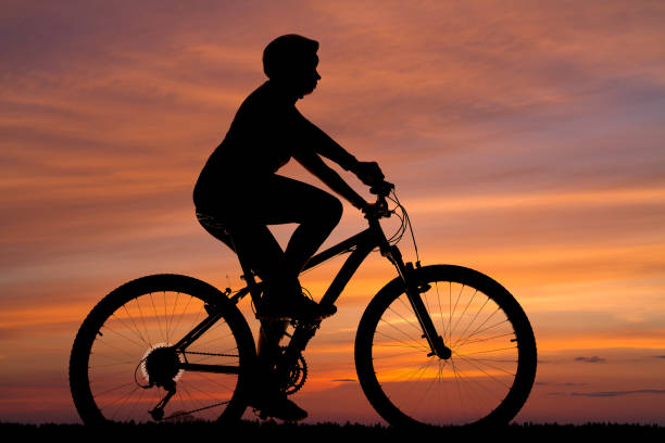 istock silhouette of a cyclist against the sunset 1327273488