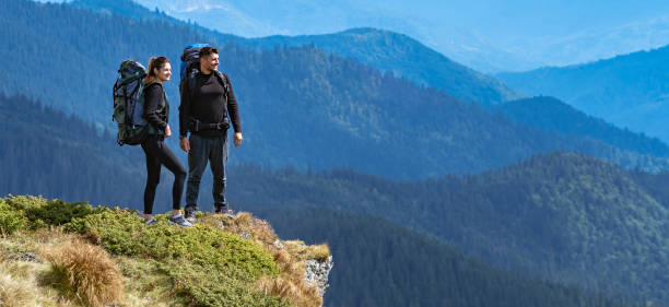 istock The happy couple standing on the cliff 1327276335