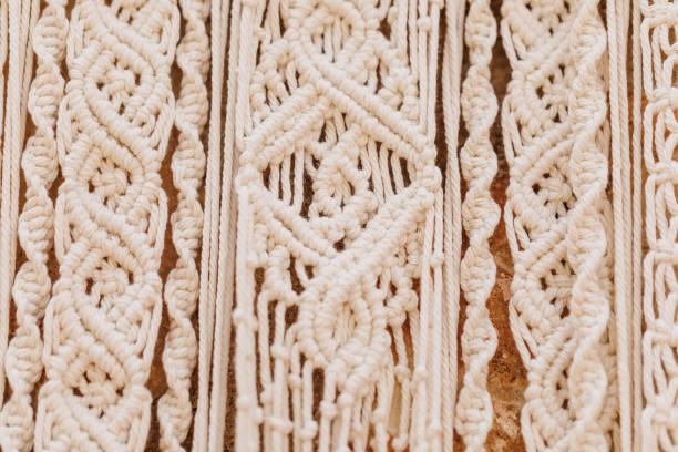 Close-up of a self made beige boho macrame wall hanger
