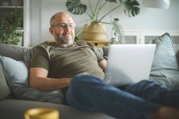 istock mature adult man working from home office ( with laptop) 1327278006