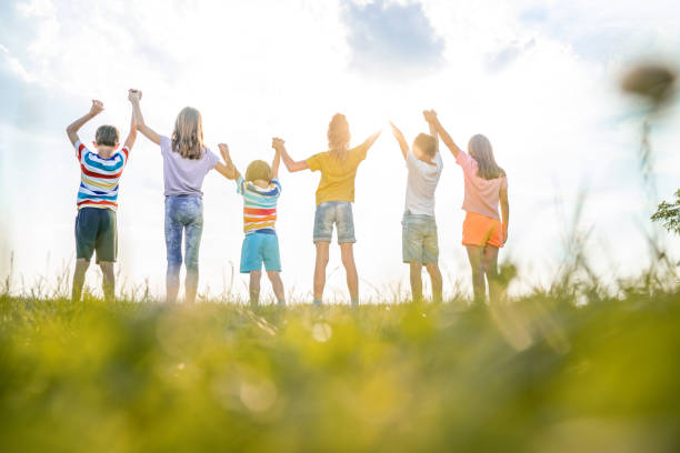 istock Rear view group of kids in nature 1327281959