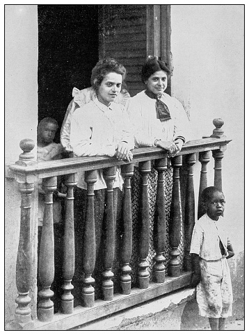 Antique black and white photograph of people from islands in the Caribbean and in the Pacific Ocean; Cuba, Hawaii, Philippines and others: Women in San Juan, Puerto Rico