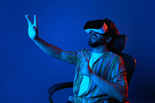 istock Bearded man trying VR headset and exploring another world isolated on white 1327289705