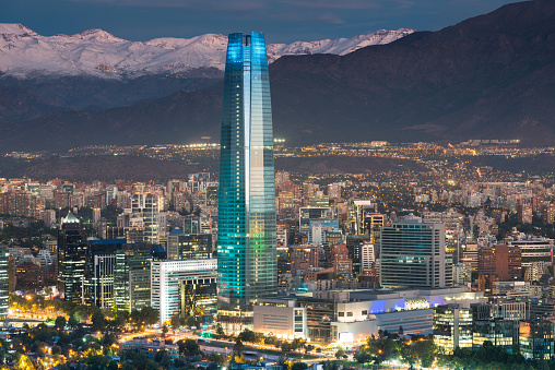 Skyline of Santiago de Chile at the foots of The Andes Mountain Range and buildings at Providencia district.