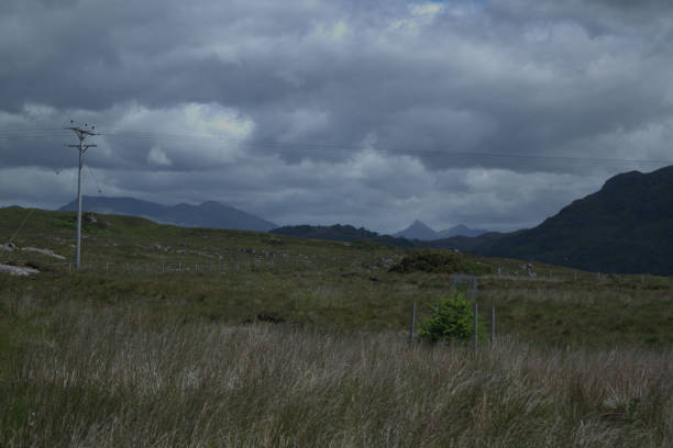 istock Hills and cliffs surrounding a bay near Arisaig 1327290032