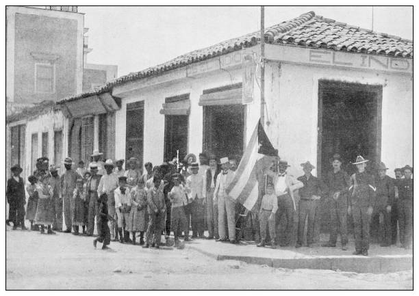 istock Antique black and white photograph: Raising the Cuban flag 1327291402