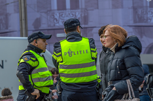 Policemen Helping Tourists At The Dam Square At Amsterdam The Netherlands 17-3-2019
