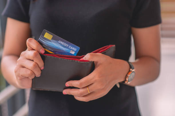 istock hand taking credit card out of pocket 1327293084
