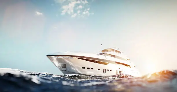 Luxury motor yacht on the ocean at sunset