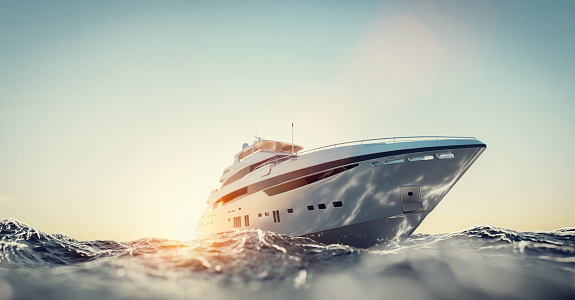 Luxury motor yacht on the ocean at sunset