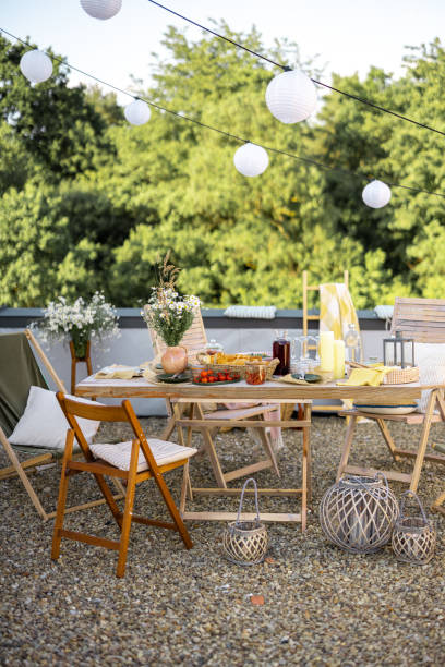 istock Beautifully decorated roof terrace with a dining table 1327298463