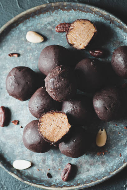 istock Chocolate vegan truffles on a plate. Homemade sweets. 1327298482