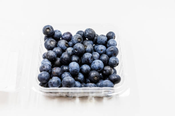 istock Close-up of blueberries against white background 1327299130