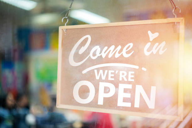 istock Come in we're open, vintage retro sign in cafe front 1327299424