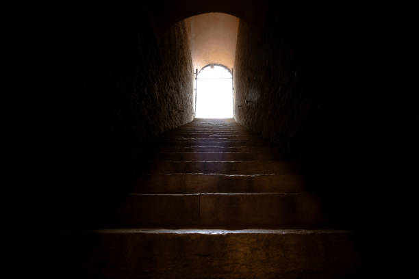 istock Stairs going to the light in the darkness 1327299462