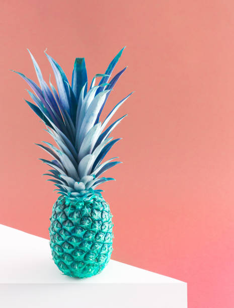 istock Blue pineapple on pink pastel background. Concept art. Minimal surrealism background. 1327299886