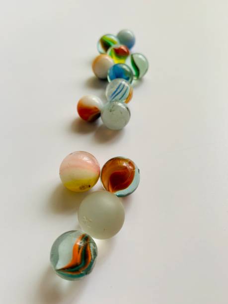 istock Glass marbles in white background 1327300662