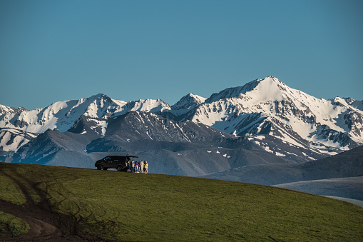 Snowy peak, Caucasus Mountains, Elbrus,Cloudscape, car,tourists