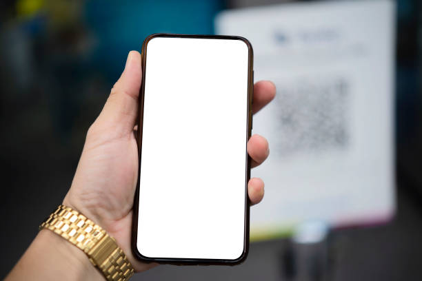 istock Mockup image of hand holding white mobile phone with blank white screen 1327303112