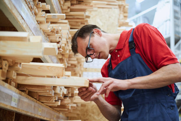 istock sales consultant reading the marking on the laminate board 1327304438