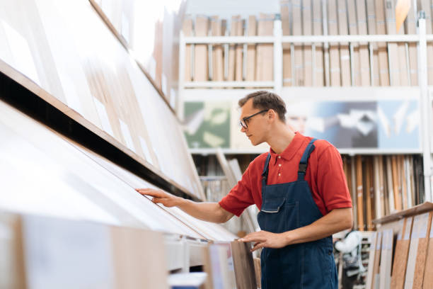 istock sales consultant inspecting samples of floor coverings 1327304552