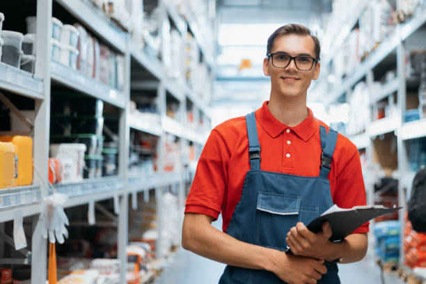 istock supervisor making notes to the clipboard while standing near a rack of building mixes 1327304765