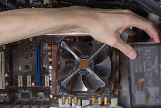 istock Connecting computer connectors, laying wires, cleaning dust. 1327305928