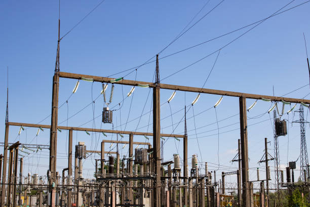 istock Pillars with power lines on blue sky background 1327309683