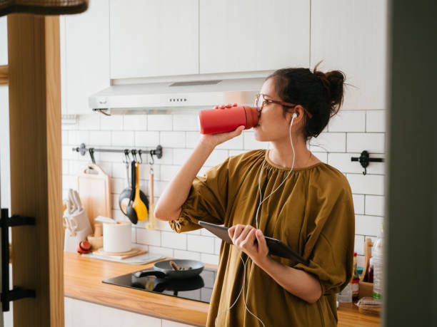 istock Asian woman working from home. 1327310411