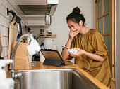Asian freelancer working in kitchen room.