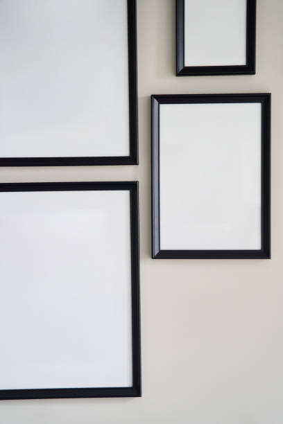 istock Different size framed photos hanging on the gray wall. Mockup 1327312185