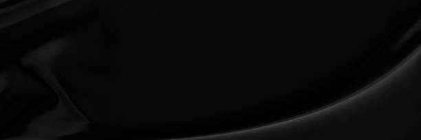 istock Black gray satin dark fabric texture luxurious shiny that is abstract silk cloth background with patterns soft waves blur beautiful. 1327314049
