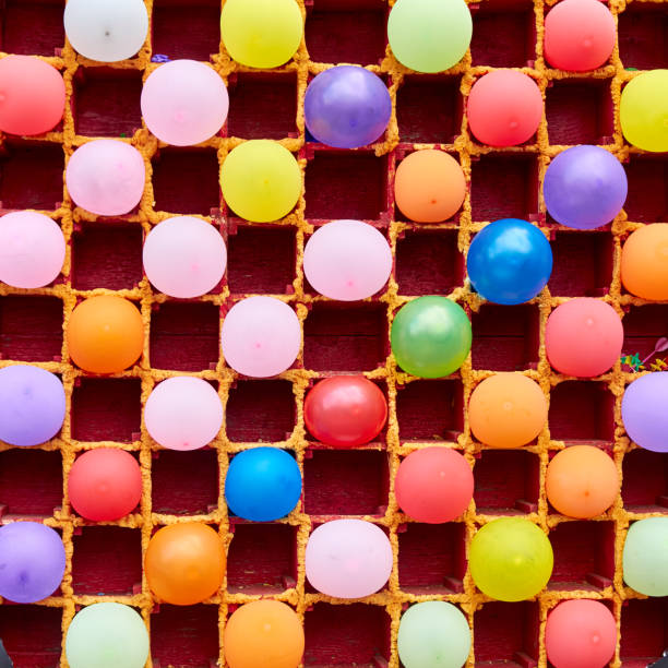 balloons in cells for a children's darts in the amusament park - rubber dart imagens e fotografias de stock