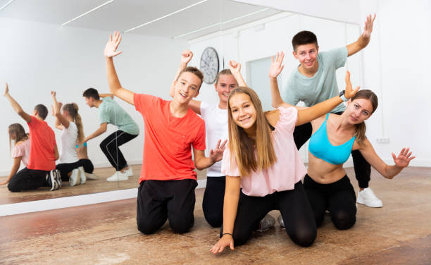istock Cheerful teenagers having fun in choreography class 1327320880