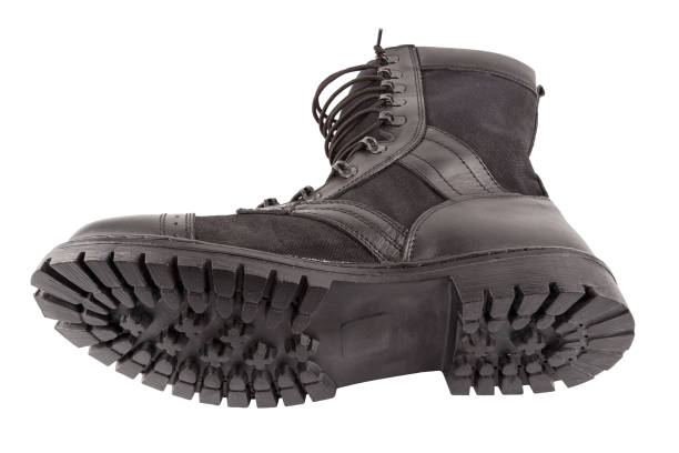 istock new black lightweight military boot isolated on white background, lying on its side 1327324346
