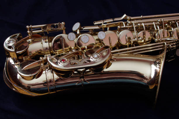istock gold saxophone on black background 1327325852