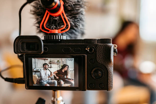 istock Two men making tutorial of playing clarinet and guitar at home 1327325954