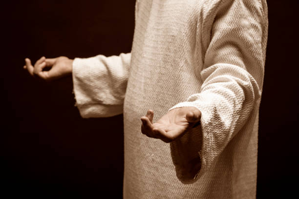 istock Jesus Christ praying to God in the dark. 1327325989